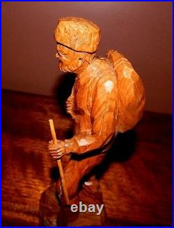 Antique woodcarving, Quebec artist, Paul E. Caron. Old Hunter with rifle, Canada