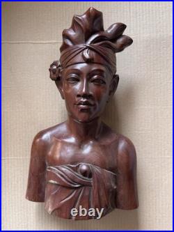 This is a hand-carved vintage Balinese wood bust sculpture