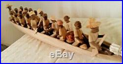 Vintage African Nigerian Thorn Wood boat carving of 20 tribal figures in a Canoe
