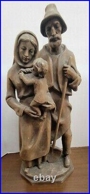 Vintage FOLK ART Hand Carved Wood Man Woman Holding Child 21 Inch