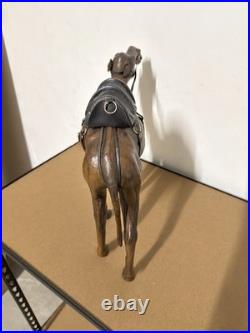 Vintage aged leather camel sculpture on hand-carved wood