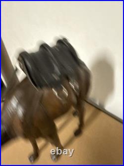 Vintage aged leather camel sculpture on hand-carved wood