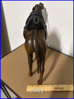 Vintage aged leather camel sculpture on hand-carved wood