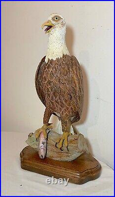 Vintage hand carved wood Folk Art bald eagle bird with fish sculpture statue
