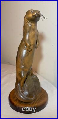 Vintage hand carved wood metal standing sea otter animal sculpture statue figure Vintage hand carved wood metal standing sea otter animal sculpture statue figure