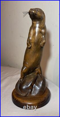 Vintage hand carved wood metal standing sea otter animal sculpture statue figure