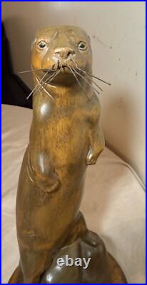 Vintage hand carved wood metal standing sea otter animal sculpture statue figure