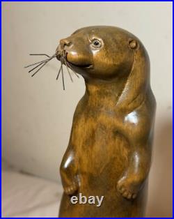 Vintage hand carved wood metal standing sea otter animal sculpture statue figure