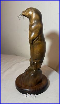 Vintage hand carved wood metal standing sea otter animal sculpture statue figure