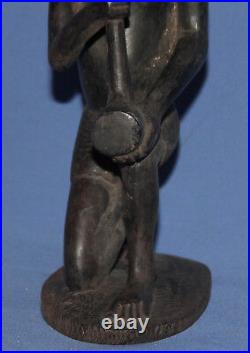 Vintage hand carved wood tribe man statuette