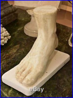 Vintage plaster foot sculpture mounted on a rectangular base