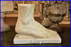 Vintage plaster foot sculpture mounted on a rectangular base